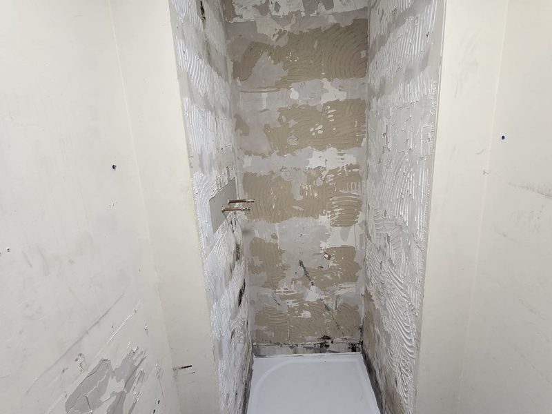 Kenny's Plumbing — bathroom renovation behind the finish