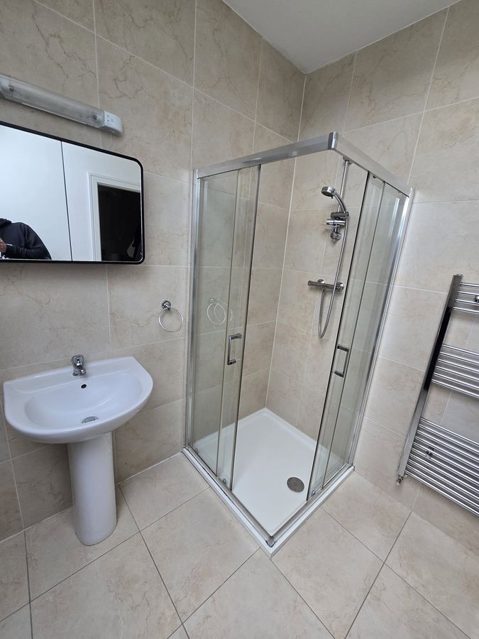 Before – chrome corner shower