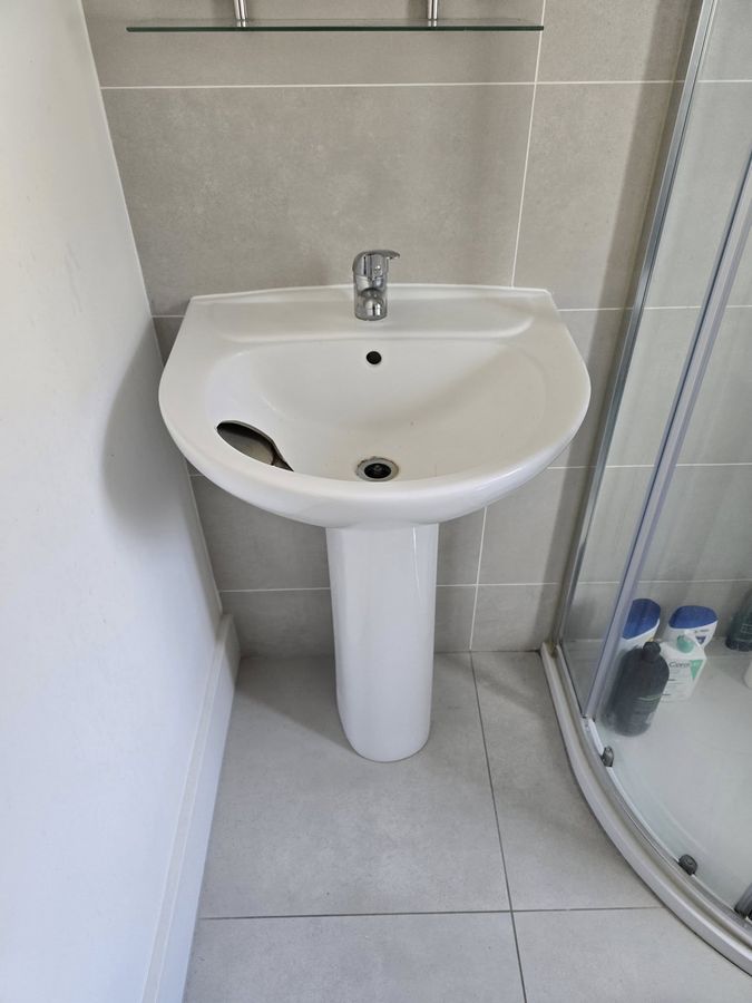 Before – old pedestal sink